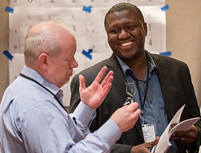 two happy employees having a discussion